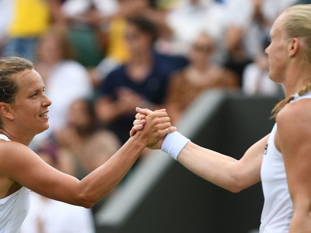 Czech Republic's Barbora Strycova is congratulated by Netherlands' Kiki Bertens after their women's singles third round match on the sixth day of the 2019 Wimbledon Championships at The All England Lawn Tennis Club in Wimbledon, southwest London, on July 6, 2019.