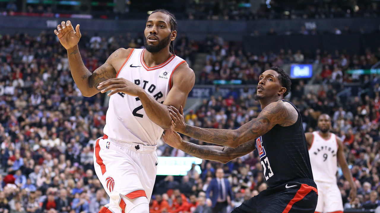 TORONTO, ON - FEBRUARY 3: Kawhi Leonard #2 of the Toronto Raptors looks for a pass in front of Lou Williams #23 of the Los Angeles Clippers in an NBA game at Scotiabank Arena on February 3, 2019 in Toronto, Ontario, Canada. The Raptors defeated the Clippers 121-103. NOTE TO USER: user expressly acknowledges and agrees by downloading and/or using this Photograph, user is consenting to the terms and conditions of the Getty Images Licence Agreement.