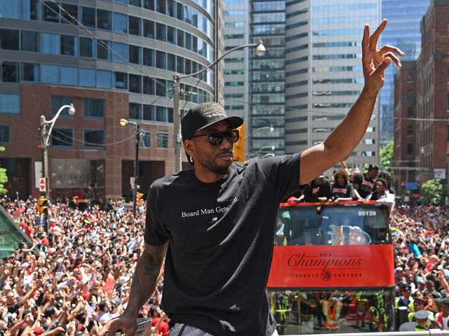 TORONTO, ON - JUNE 17: Kawhi Leonard #2 of the Toronto Raptors acknowledges the crowd during the Toronto Raptors Championship Victory Parade on June 17, 2019 in Toronto, Ontario. NOTE TO USER: User expressly acknowledges and agrees that, by downloading and/or using this photograph, user is consenting to the terms and conditions of Getty Images License Agreement. Mandatory Copyright Notice: Copyright 2019 NBAE