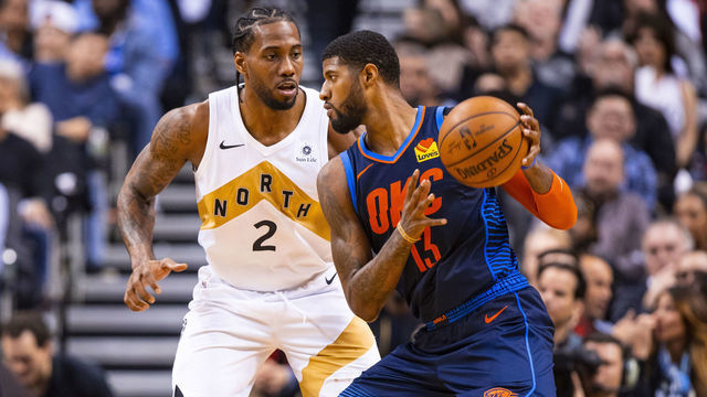 TORONTO, CANADA - MARCH 22: Paul George #13 of the Oklahoma City Thunder handles the ball against Kawhi Leonard #2 of the Toronto Raptors on March 22, 2019 at Scotiabank Arena in Toronto, Ontario, Canada. NOTE TO USER: User expressly acknowledges and agrees that, by downloading and/or using this photograph, user is consenting to the terms and conditions of the Getty Images License Agreement. Mandatory Copyright Notice: Copyright 2019 NBAE