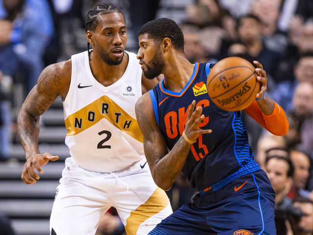 TORONTO, CANADA - MARCH 22: Paul George #13 of the Oklahoma City Thunder handles the ball against Kawhi Leonard #2 of the Toronto Raptors on March 22, 2019 at Scotiabank Arena in Toronto, Ontario, Canada. NOTE TO USER: User expressly acknowledges and agrees that, by downloading and/or using this photograph, user is consenting to the terms and conditions of the Getty Images License Agreement. Mandatory Copyright Notice: Copyright 2019 NBAE
