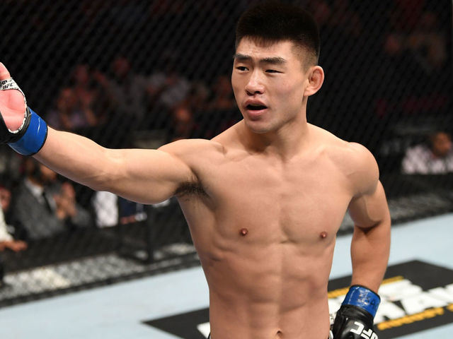 LAS VEGAS, NV - JULY 06: Song Yadong of China celebrates his win over Alejandro Perez of Mexico in their bantamweight fight during the UFC 239 event at T-Mobile Arena on July 6, 2019 in Las Vegas, Nevada.