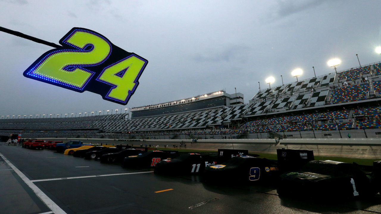 DAYTONA BEACH, FLORIDA - JULY 06: Cars sit along pit road in the rain prior to the start of the Monster Energy NASCAR Cup Series Coke Zero Sugar 400 at Daytona International Speedway on July 06, 2019 in Daytona Beach, Florida.