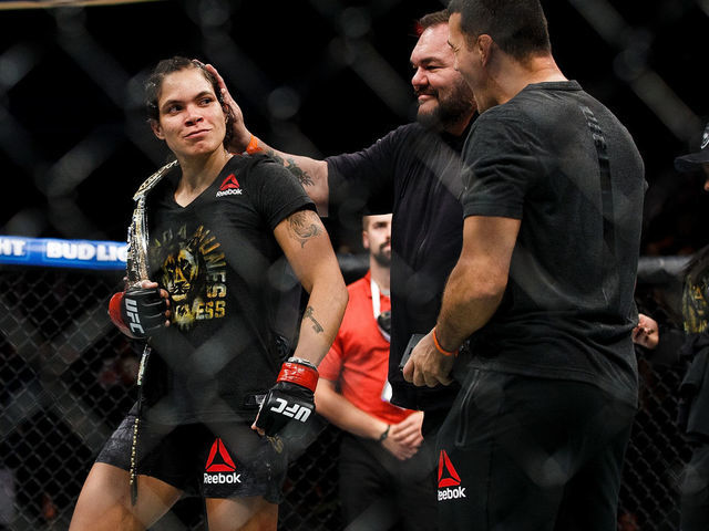 EDMONTON, AB - SEPTEMBER 09: Amanda Nunes celebrates her victory against Valentina Shevchenko during UFC 215 at Rogers Place on September 9, 2017 in Edmonton, Canada.