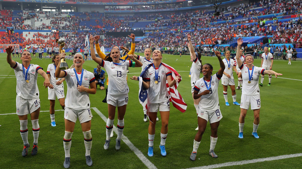 LYON, FRANCE - JULY 07: USA players celebrate with the FIFA Women's World Cup Trophy following their team's victory in the 2019 FIFA Women's World Cup France Final match between The United States of America and The Netherlands at Stade de Lyon on July 07, 2019 in Lyon, France.