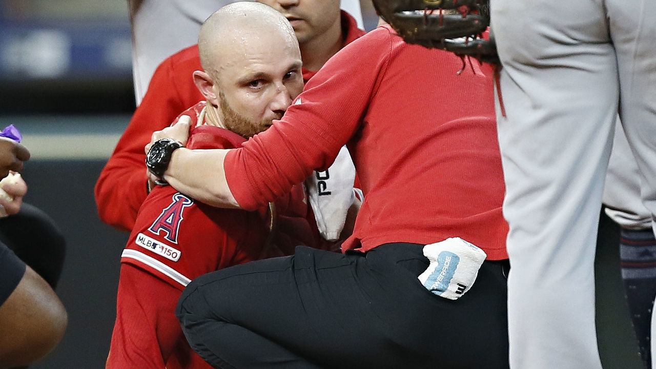 HOUSTON, TEXAS - JULY 07: Jonathan Lucroy #20 of the Los Angeles Angels of Anaheim is tended to by medical staff after he was involved in a collision with Jake Marisnick #6 of the Houston Astros who was trying to score in the eighth inning at Minute Maid Park on July 07, 2019 in Houston, Texas. Marisnick was called out on the home plate collision rule.