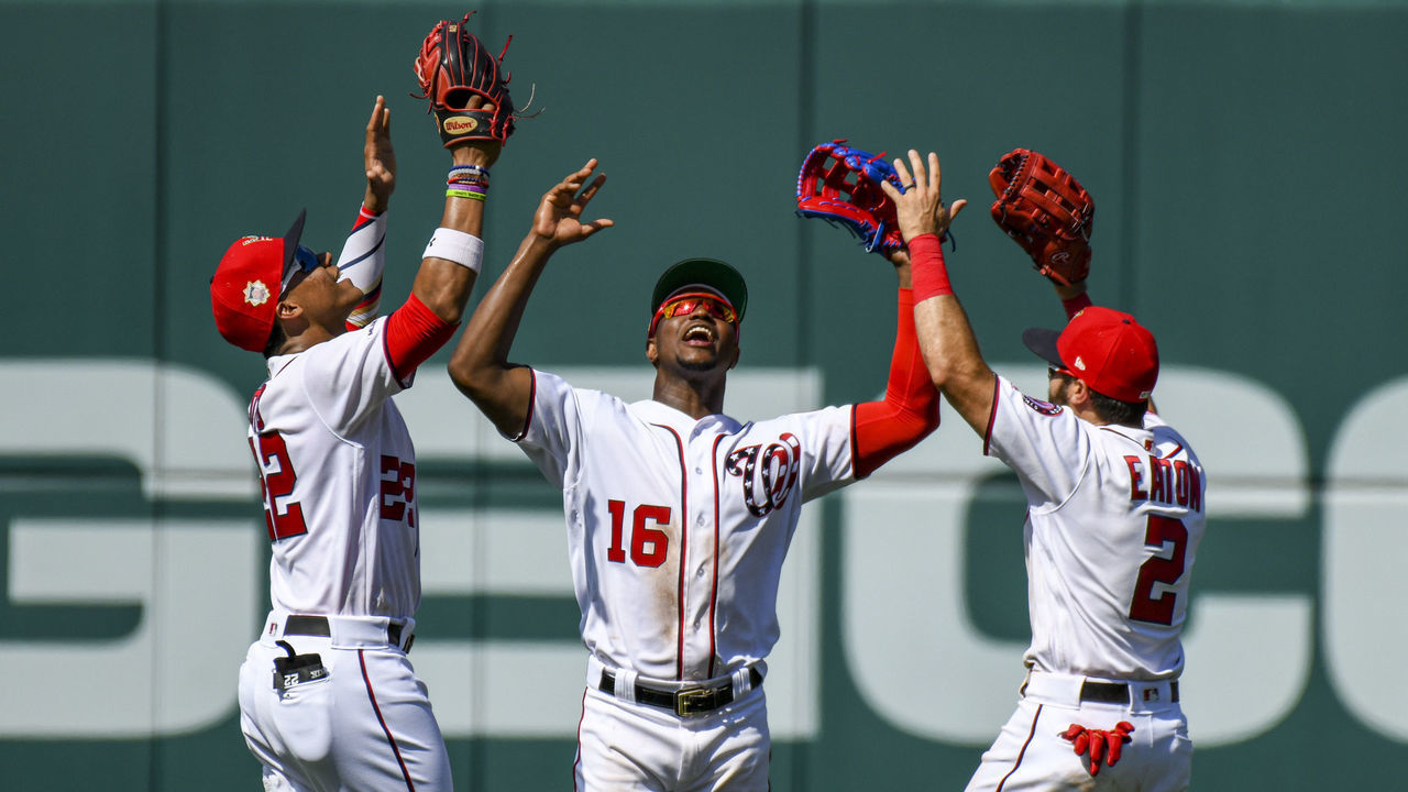 WASHINGTON, DC - JULY 07: Washington Nationals left fielder Juan Soto (22), center fielder Victor Robles (16) and right fielder Adam Eaton (2) celebrate following the game between the Kansas City Royals and the Washington Nationals on July 7, 2019, at Nationals Park, in Washington D.C.