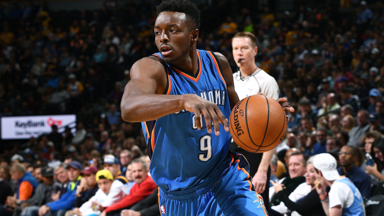 DENVER, CO - NOVEMBER 25: Jerami Grant #9 of the Oklahoma City Thunder handles the ball during the game against the Denver Nuggets on November 25, 2016 at the Pepsi Center in Denver, Colorado. NOTE TO USER: User expressly acknowledges and agrees that, by downloading and/or using this Photograph, user is consenting to the terms and conditions of the Getty Images License Agreement. Mandatory Copyright Notice: Copyright 2016 NBAE