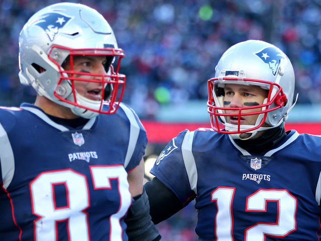 FOXBOROUGH, MASSACHUSETTS - JANUARY 13: Tom Brady #12 of the New England Patriots and Rob Gronkowski #87 react during the second quarter in the AFC Divisional Playoff Game against the Los Angeles Chargers at Gillette Stadium on January 13, 2019 in Foxborough, Massachusetts.