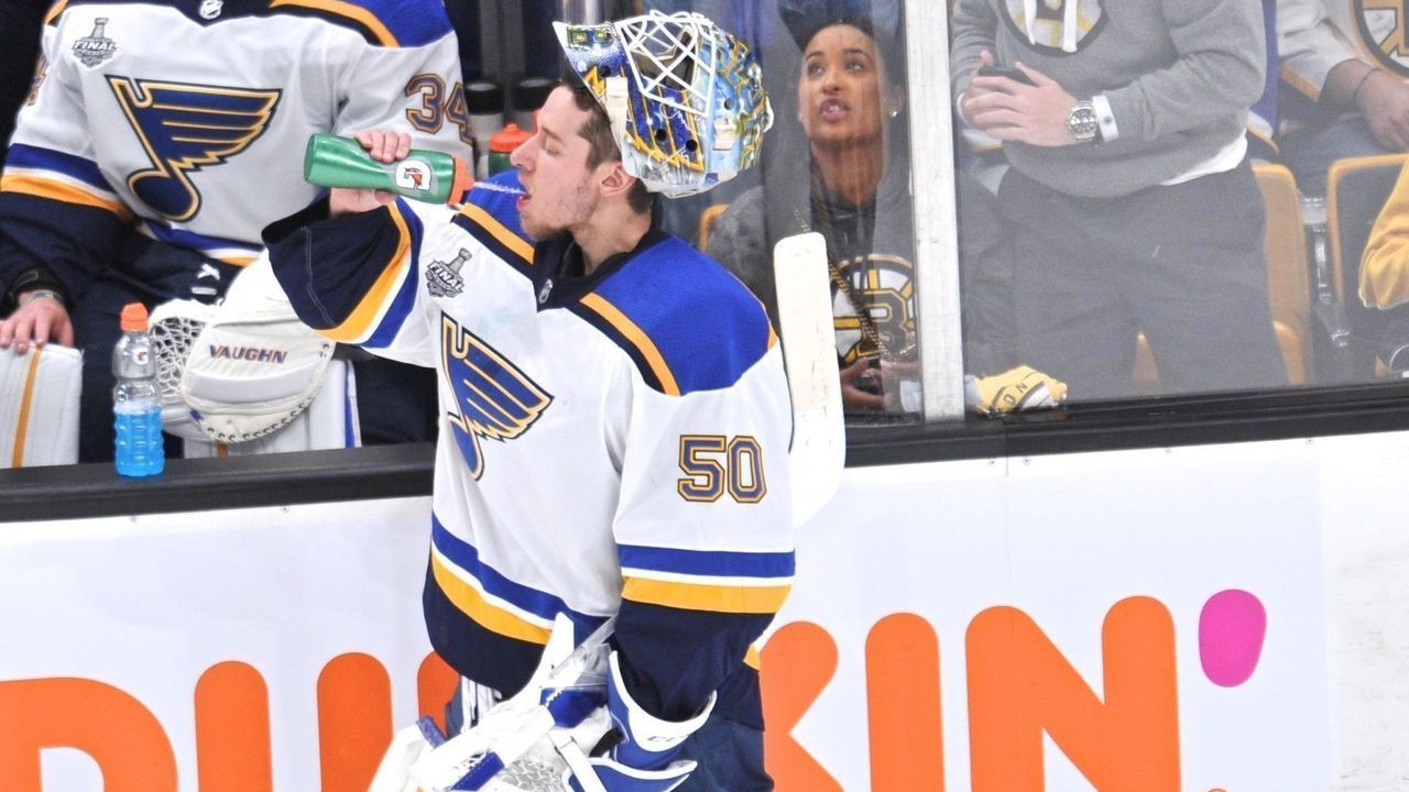 BOSTON, MA - JUNE 12: St. Louis Blues goaltender Jordan Binnington (50) gets some water while in a tv timeout. During Game 7 of the Stanley Cup Finals featuring the St Louis Blues against the Boston Bruins on June 12, 2019 at TD Garden in Boston, MA.