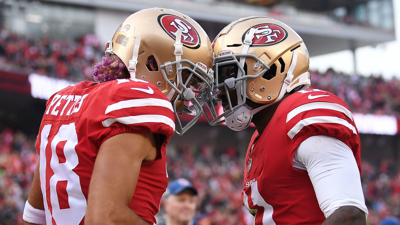 SANTA CLARA, CA - DECEMBER 09: Dante Pettis #18 of the San Francisco 49ers celebrates with Marquise Goodwin #11 after scoring on a one-yard catch against the Denver Broncos during their NFL game at Levi's Stadium on December 9, 2018 in Santa Clara, California.