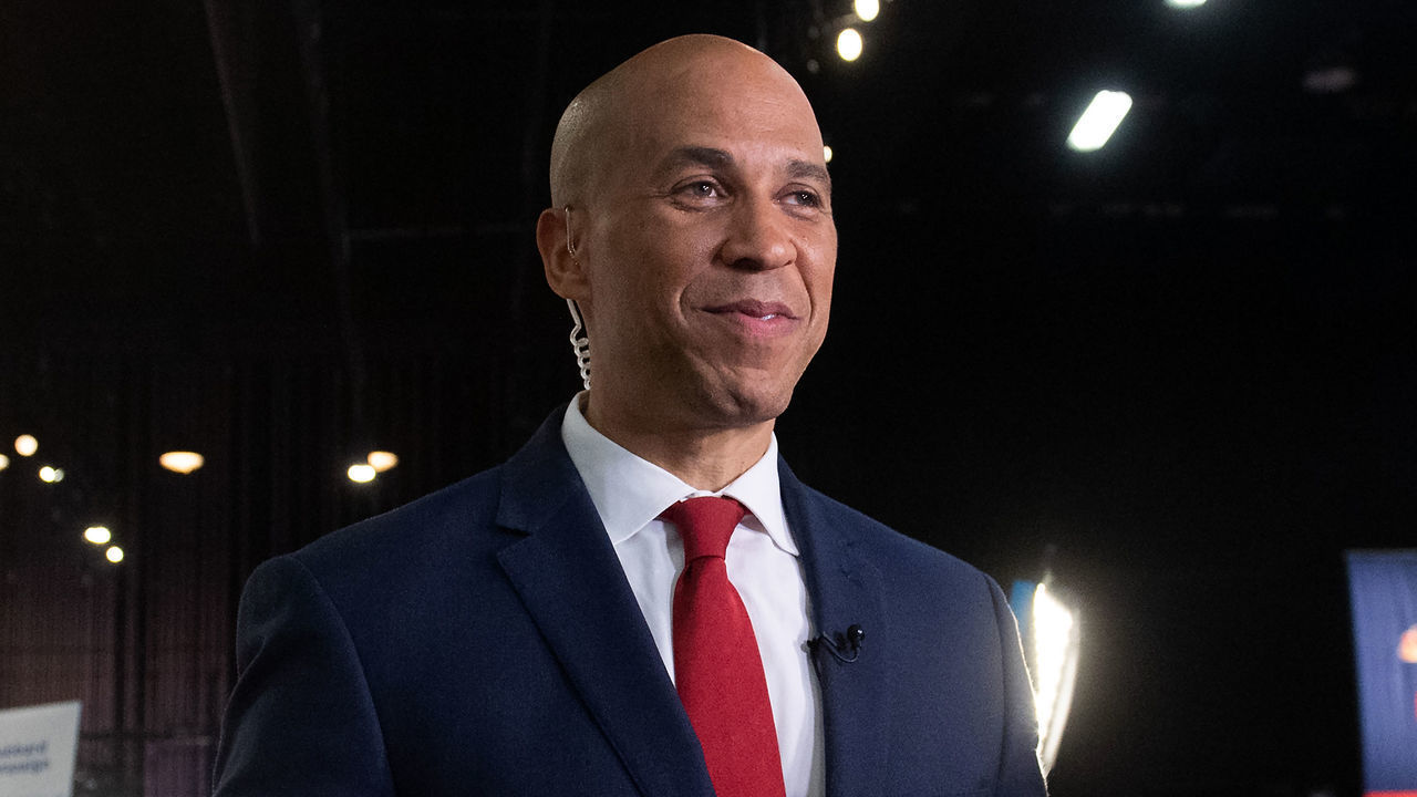 Democratic presidential hopeful US Senator from New Jersey Cory Booker arrives to the Spin Room to speak to the press after participating in the first Democratic primary debate of the 2020 presidential campaign season hosted by NBC News at the Adrienne Arsht Center for the Performing Arts in Miami, Florida, June 26, 2019.