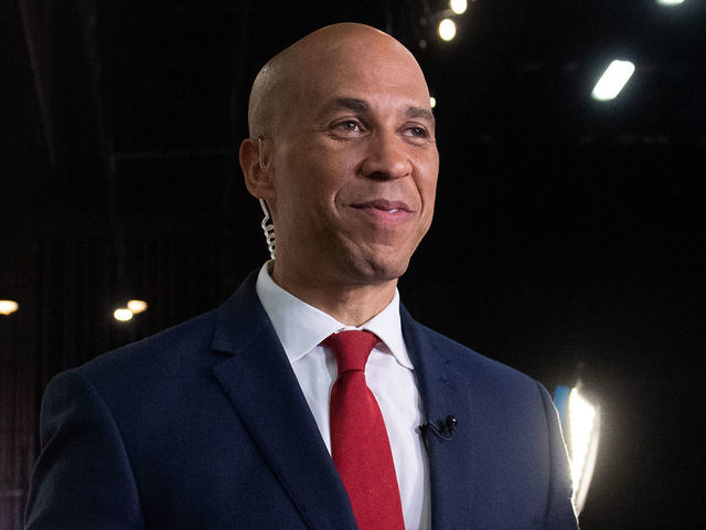 Democratic presidential hopeful US Senator from New Jersey Cory Booker arrives to the Spin Room to speak to the press after participating in the first Democratic primary debate of the 2020 presidential campaign season hosted by NBC News at the Adrienne Arsht Center for the Performing Arts in Miami, Florida, June 26, 2019.