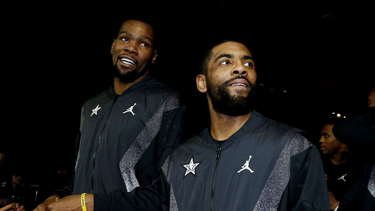 CHARLOTTE, NC - FEBRUARY 17: Kevin Durant #35 and Kyrie Irving #11 of Team LeBron are seen during the 2019 NBA All-Star Game on February 17, 2019 at the Spectrum Center in Charlotte, North Carolina. NOTE TO USER: User expressly acknowledges and agrees that, by downloading and/or using this photograph, user is consenting to the terms and conditions of the Getty Images License Agreement. Mandatory Copyright Notice: Copyright 2019 NBAE