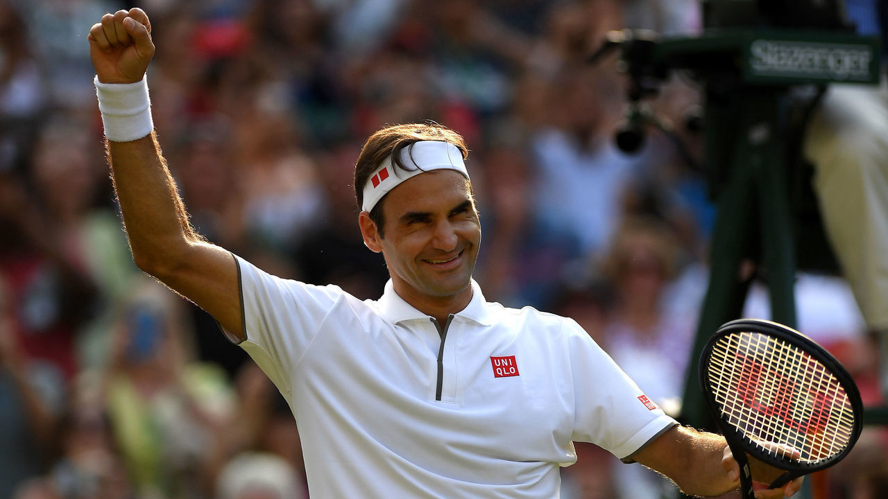 LONDON, ENGLAND - JULY 10: Roger Federer of Switzerland celebrates victory in his Men's Singles Quarter Final match against Kei Nishikori of Japan during Day Nine of The Championships - Wimbledon 2019 at All England Lawn Tennis and Croquet Club on July 10, 2019 in London, England.