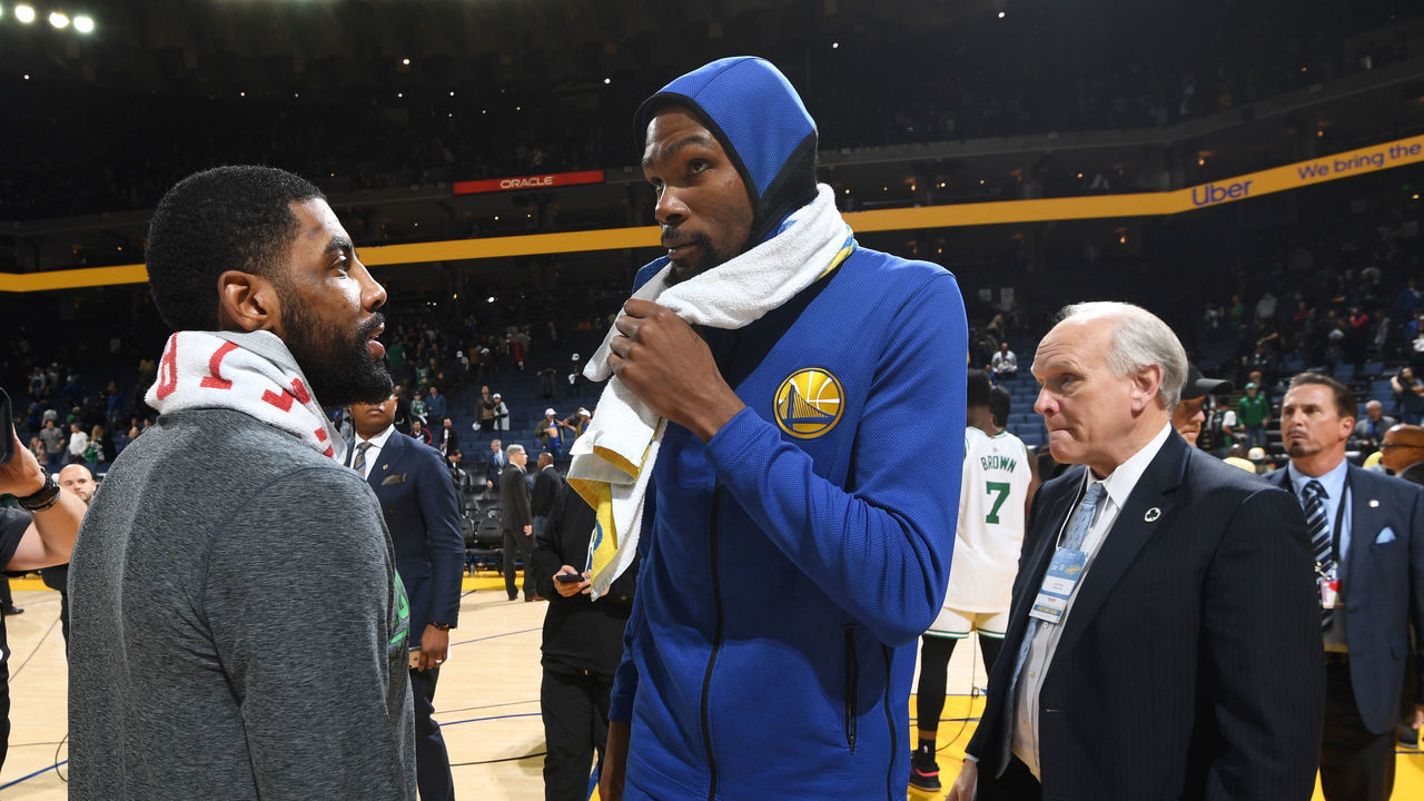 OAKLAND, CA - MARCH 5: Kyrie Irving #11 of the Boston Celtics speaks with Kevin Durant #35 of the Golden State Warriors after the game on March 5, 2019 at ORACLE Arena in Oakland, California. NOTE TO USER: User expressly acknowledges and agrees that, by downloading and or using this photograph, user is consenting to the terms and conditions of Getty Images License Agreement. Mandatory Copyright Notice: Copyright 2019 NBAE