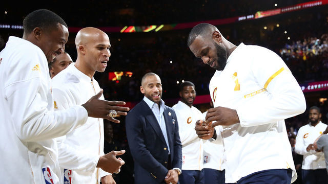 CLEVELAND, OH - OCTOBER 25: Channing Frye #8 and Richard Jefferson #24 react with LeBron James #23 of the Cleveland Cavaliers after receiving their championship rings before the game against the New York Knicks at Quicken Loans Arena on October 25, 2016 in Cleveland, Ohio.