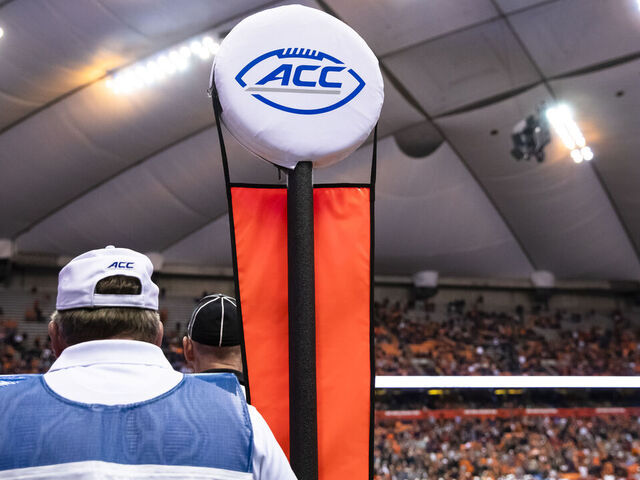 SYRACUSE, NY - OCTOBER 27: An official stands with a down marker bearing the ACC logo during the game between the Syracuse Orange and the North Carolina State Wolfpack at the Carrier Dome on October 27, 2018 in Syracuse, New York. Syracuse upsets North Carolina State 51-41. *** Local Caption ***