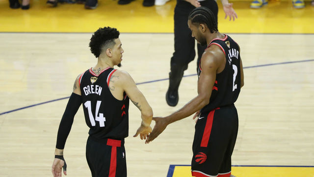 OAKLAND, CA - JUNE 5: Danny Green #14 hi-fives Kawhi Leonard #2 of the Toronto Raptors during Game Three of the NBA Finals on June 5, 2019 at ORACLE Arena in Oakland, California. NOTE TO USER: User expressly acknowledges and agrees that, by downloading and/or using this photograph, user is consenting to the terms and conditions of Getty Images License Agreement. Mandatory Copyright Notice: Copyright 2019 NBAE
