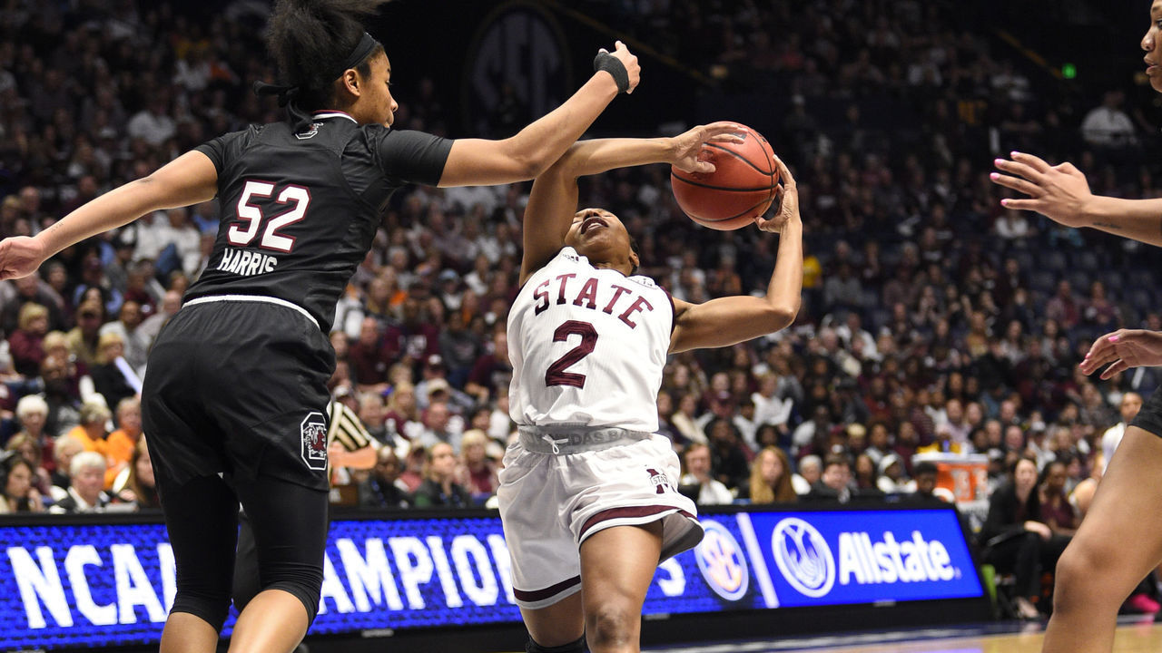 NASHVILLE, TN - MARCH 04: South Carolina Gamecocks guard Tyasha Harris (52) fouls South Carolina Gamecocks guard Te'a Cooper (2) as she drives the lane during the second period between the South Carolina Gamecocks and the Mississippi State Lady Bulldogs in a SEC Women's Tournament game on on March 4, 2018, at Bridgestone Arena in Nashville, TN.