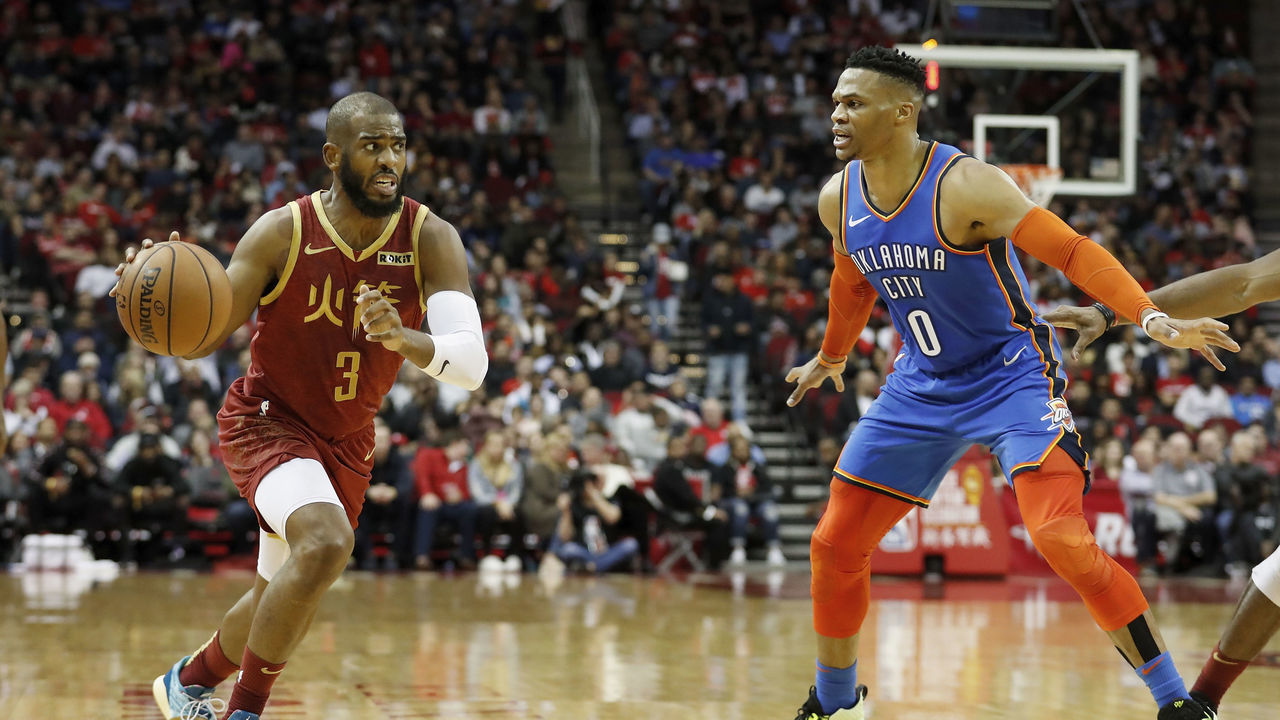 HOUSTON, TX - FEBRUARY 09: Chris Paul #3 of the Houston Rockets drives to the basket defended by Russell Westbrook #0 of the Oklahoma City Thunder in the first half at Toyota Center on February 9, 2019 in Houston, Texas.