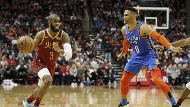 HOUSTON, TX - FEBRUARY 09: Chris Paul #3 of the Houston Rockets drives to the basket defended by Russell Westbrook #0 of the Oklahoma City Thunder in the first half at Toyota Center on February 9, 2019 in Houston, Texas.
