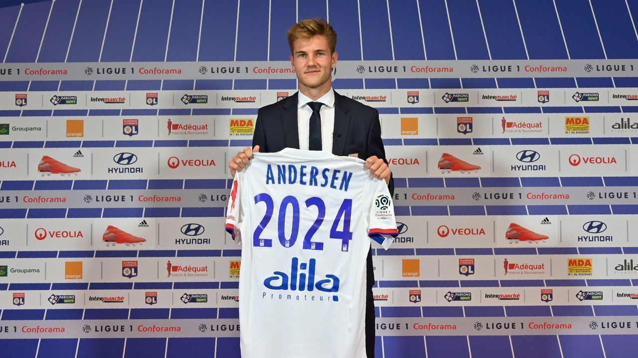 Danish defender Joachim Andersen poses for a photo with his new jersey of the Olympique Lyonnais during a press conference on July 12, 2019, at the Groupama Stadium in Decines-Charpieu near Lyon, central-eastern France.