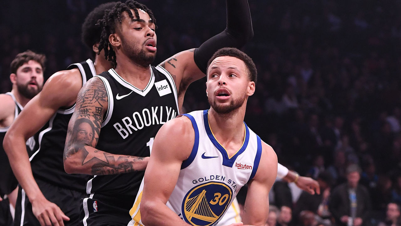 NEW YORK, NY - OCTOBER 28: Stephen Curry #30 of the Golden State Warriors handles the ball against D'Angelo Russell #1 of the Brooklyn Nets during the game at Barclays Center on October 28, 2018 in the Brooklyn borough of New York City.