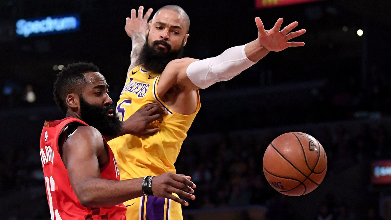 LOS ANGELES, CALIFORNIA - FEBRUARY 21: James Harden #13 of the Houston Rockets makes a pass to Clint Capela #15 in front of Tyson Chandler #5 of the Los Angeles Lakers during the first half at Staples Center on February 21, 2019 in Los Angeles, California.