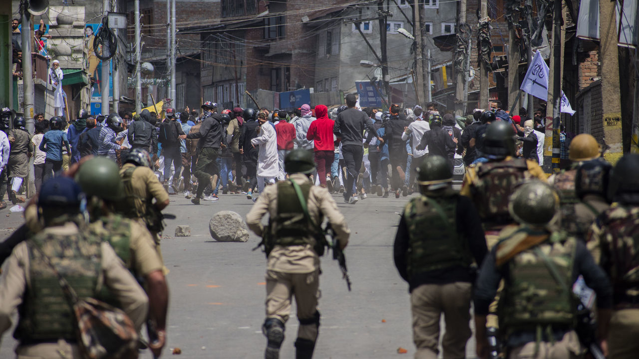 SRINAGAR, KASHMIR, INDIA - JUNE 05: : Kashmiri Muslim protester clash with Indian government forces during a protest against Indian rule, after prayers on Eid-ul-Fitr, a festival of Muslims on June 05, 2019 in Srinagar, the summer capital of Indian administered Kashmir, India. Suspected militants shot dead a Muslim woman on Wednesday in south Kashmirs Pulwama district, police said. Meanwhile dozens of Kashmir Muslim protesters were wounded after Indian government forces fired metal pellets at them when they took to streets chanting pro Kashmir freedom and 'anti-India' slogans, in protest against Indian rule and recent civilian killings. Thousands of Kashmiri Muslim clashed with Indian government forces after Eid prayers during anti Indian protests .Muslims all over the world are celebrating Eid ul-Fitr festival, a three-day celebration marking the end of the holy fasting month of Ramadan. A large number of Indian government forces were deployed on the streets by the Indian authorities in Kashmir to thwart anti-India protest on the occasion of Eid-ul-Fitr a Muslim festival.