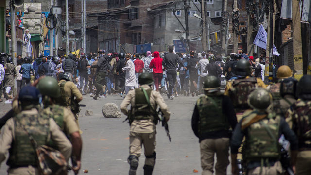 SRINAGAR, KASHMIR, INDIA - JUNE 05: : Kashmiri Muslim protester clash with Indian government forces during a protest against Indian rule, after prayers on Eid-ul-Fitr, a festival of Muslims on June 05, 2019 in Srinagar, the summer capital of Indian administered Kashmir, India. Suspected militants shot dead a Muslim woman on Wednesday in south Kashmirs Pulwama district, police said. Meanwhile dozens of Kashmir Muslim protesters were wounded after Indian government forces fired metal pellets at them when they took to streets chanting pro Kashmir freedom and 'anti-India' slogans, in protest against Indian rule and recent civilian killings. Thousands of Kashmiri Muslim clashed with Indian government forces after Eid prayers during anti Indian protests .Muslims all over the world are celebrating Eid ul-Fitr festival, a three-day celebration marking the end of the holy fasting month of Ramadan. A large number of Indian government forces were deployed on the streets by the Indian authorities in Kashmir to thwart anti-India protest on the occasion of Eid-ul-Fitr a Muslim festival.