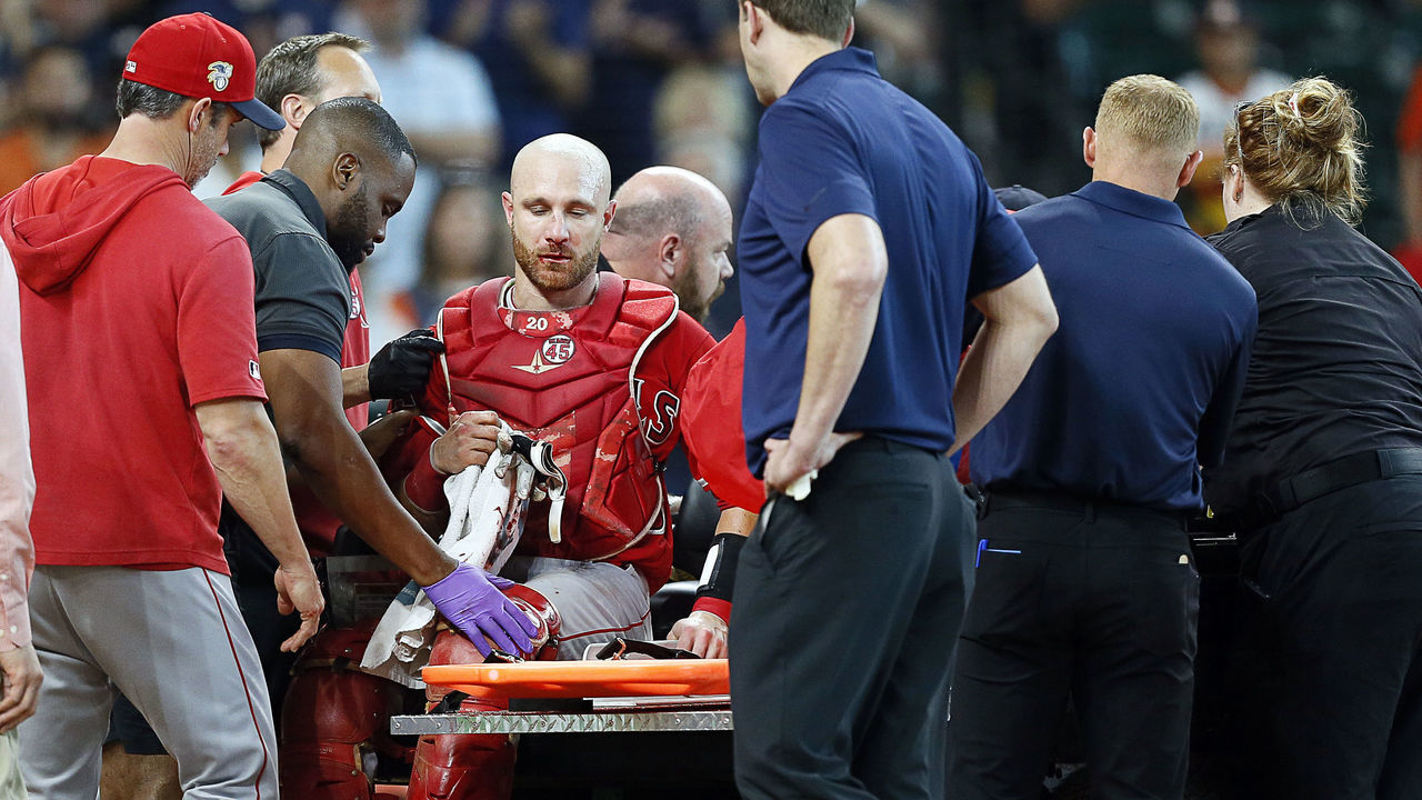 HOUSTON, TEXAS - JULY 07: Jonathan Lucroy #20 of the Los Angeles Angels of Anaheim is tended to by medical staff after a collision at home plate with Jake Marisnick #6 of the Houston Astros in the eighth inning at Minute Maid Park on July 07, 2019 in Houston, Texas.