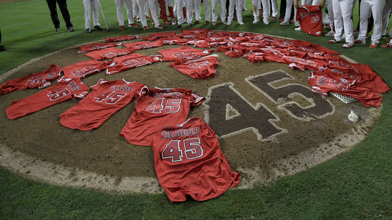 ANAHEIM, CA - JULY 12: Los Angeles Angels of Anaheim players lay their jerseys on the pitchers mound after they won a combined no-hitter agasint the Seattle Mariners at Angel Stadium of Anaheim on July 12, 2019 in Anaheim, California. The entire Angels team wore Tyler Skaggs #45 jersey to honor him after his death on July 1. Angels won 13-0.