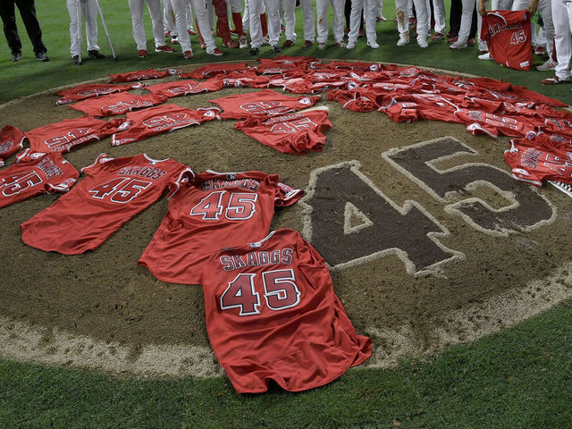 ANAHEIM, CA - JULY 12: Los Angeles Angels of Anaheim players lay their jerseys on the pitchers mound after they won a combined no-hitter agasint the Seattle Mariners at Angel Stadium of Anaheim on July 12, 2019 in Anaheim, California. The entire Angels team wore Tyler Skaggs #45 jersey to honor him after his death on July 1. Angels won 13-0.