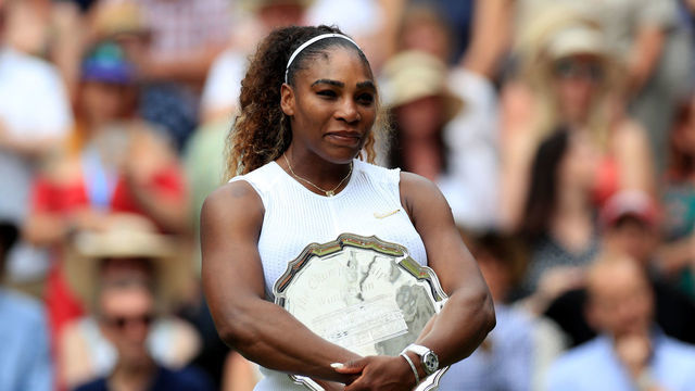 Serena Williams looks dejected after defeat to Simona Halep on day twelve of the Wimbledon Championships at the All England Lawn Tennis and Croquet Club, Wimbledon.