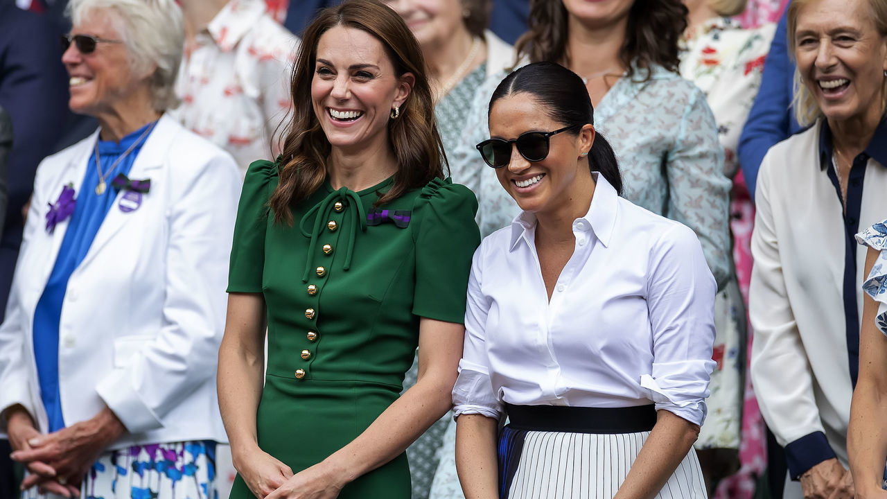 13th July 2019, The All England Lawn Tennis and Croquet Club, Wimbledon, England, Wimbledon Tennis Tournament, Day 12; Catherine Duchess of Cambridge and Meghan Duchess of Sussex smile and laugh as Simona Halep (ROM) is interviewed