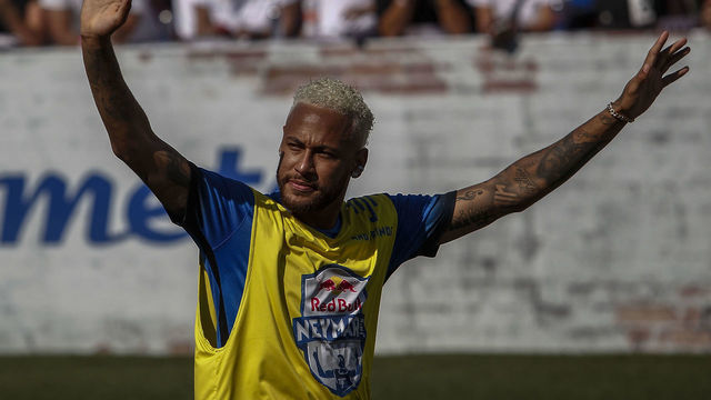 Brazilian football star Neymar celebrates after scoring during a five-a-side football tournament for his charity Neymar Junior Project Institute, in Praia Grande, Sao Paulo, Brazil, on July 13, 2019.