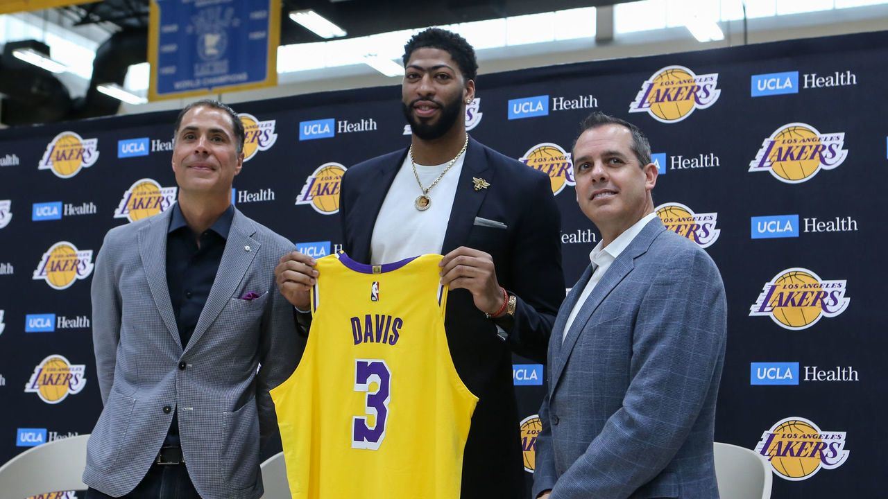 EL SEGUNDO, CA - JULY 13: Anthony Davis showing off new jersey with general manager Rob Pelika and coach Frank Vogel during the presentation as new player of Los Angeles Lakers on July 13, 2019, at UCLA Health Training Center in El Segundo, CA.