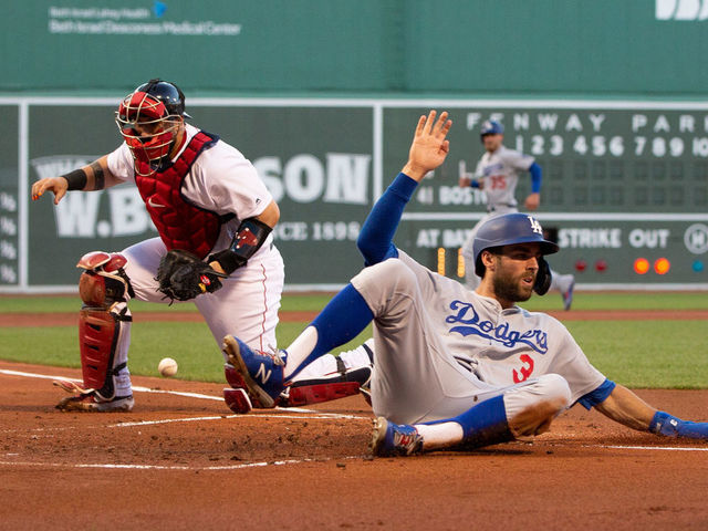 Boston Red Sox Brock Holt tags out Los Angeles Dodgers' Cody