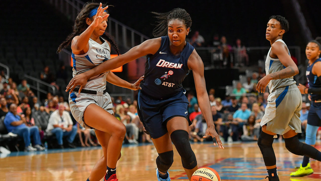 ATLANTA, GA JULY 12: Atlanta's Elizabeth Williams dribbles through traffic during the WNBA game between the Minnesota Lynx and the Atlanta Dream on July 12th, 2019 at State Farm Arena in Atlanta, GA.