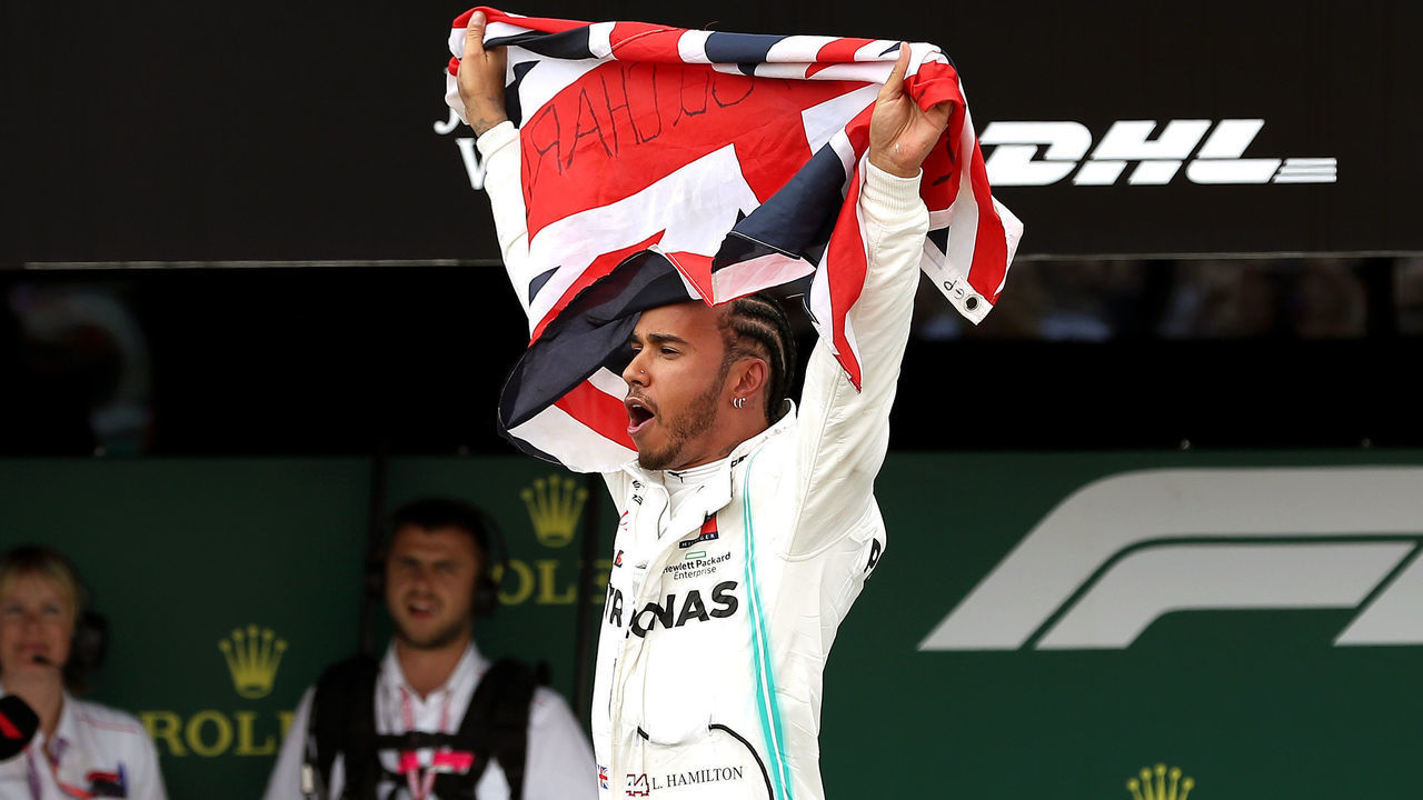 Mercedes driver Lewis Hamilton celebrates winning the British Grand Prix during the British Grand Prix at Silverstone, Towcester.