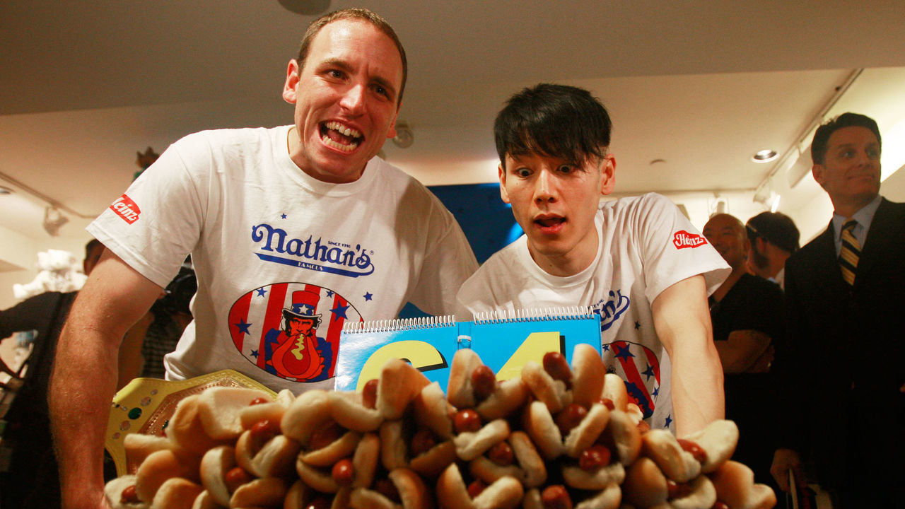 NEW YORK - JULY 02: Former champion Takeru Kobayashi (R) and reigning champion Joey Chestnut look on at the Nathan's Famous Fourth of July International Hot Dog Eating Contest official weigh-in ceremony July 2, 2009 in New York City. Chestnut defeated arch rival Kobayashi of Japan in an overtime battle last year by consuming 64 hot dogs.