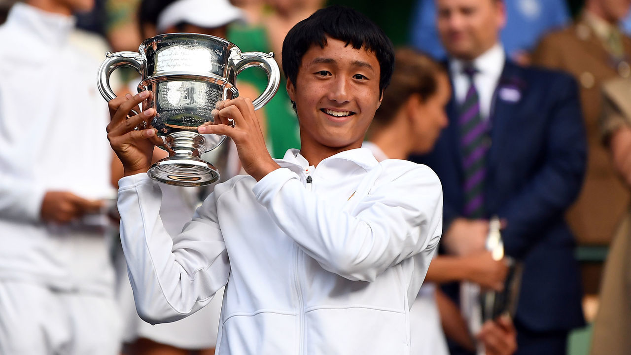 Shintaro Mochizuki with the trophy after winning the Boys Singles on day thirteen of the Wimbledon Championships at the All England Lawn Tennis and Croquet Club, Wimbledon.
