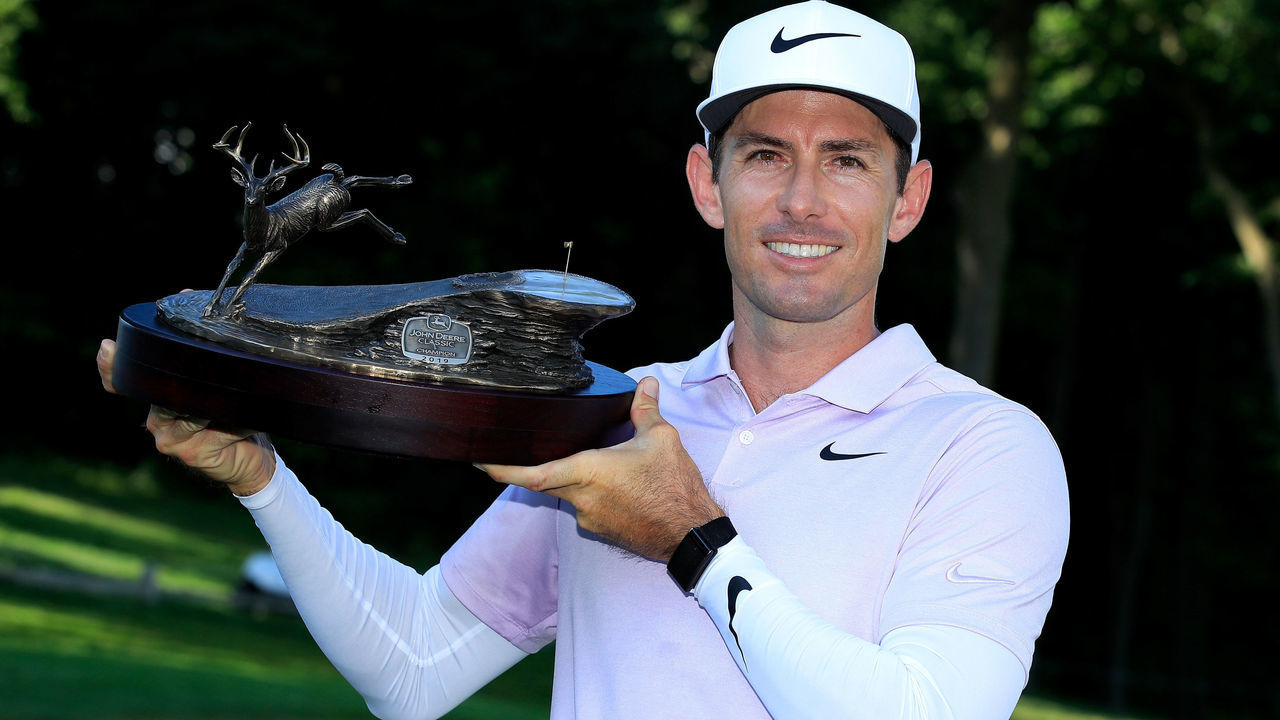 SILVIS, ILLINOIS - JULY 14: Dylan Frittelli of South Africa celebrates with the trophy after winning the John Deere Classic at TPC Deere Run on July 14, 2019 in Silvis, Illinois.