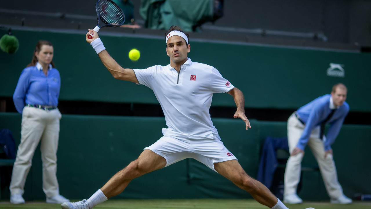 14th July 2019, The All England Lawn Tennis and Croquet Club, Wimbledon, England, Wimbledon Tennis Tournament, Day 13, mens singles final; Roger Federer (SUI) with a forehand to Novak Djokovic (SER)