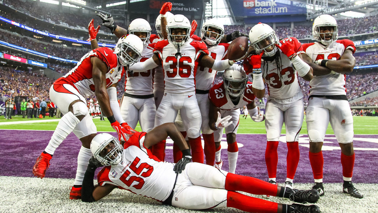 MINNEAPOLIS, MN - OCTOBER 14: The Arizona Cardinals pose for a photo after strong safety Budda Baker (36), center, returned an interception for a touchdown in the 2nd quarter to make it 10-9 Vikings during the regular season game between the Arizona Cardinals and the Minnesota Vikings on October 14, 2018 at U.S. Bank Stadium in Minneapolis, Minnesota.