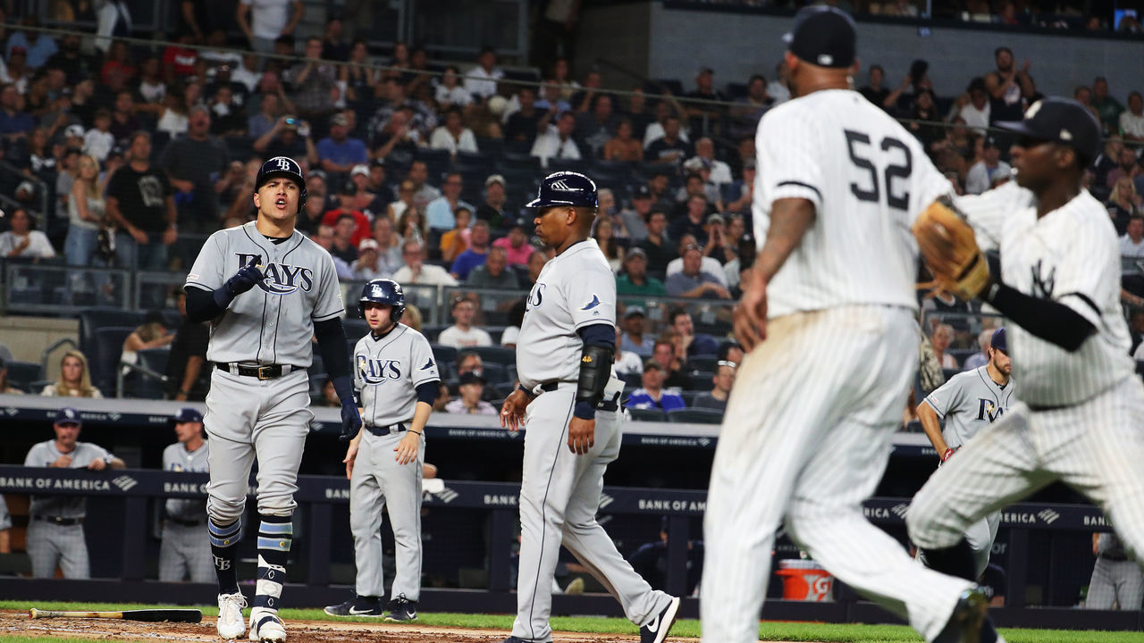 NEW YORK, NEW YORK - JULY 16: Avisail Garcia #24 of the Tampa Bay Rays has words with CC Sabathia #52 of the New York Yankees after an at bat in the sixth inning during their at Yankee Stadium on July 16, 2019 in New York City.