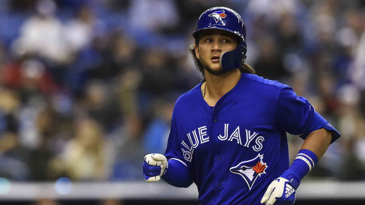 MONTREAL, QC - MARCH 25: Bo Bichette #66 of the Toronto Blue Jays runs off the field against the Milwaukee Brewers during MLB spring training at Olympic Stadium on March 25, 2019 in Montreal, Quebec, Canada. The Milwaukee Brewers defeated the Toronto Blue Jays 10-5.