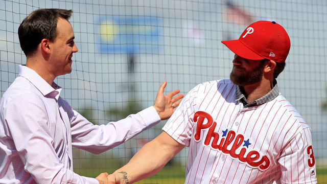 CLEARWATER, FLORIDA - MARCH 02: Bryce Harper is introduced to the Philadelphia Phillies by General Manager Matt Klentak during a press conference at Spectrum Stadium on March 02, 2019 in Clearwater, Florida.