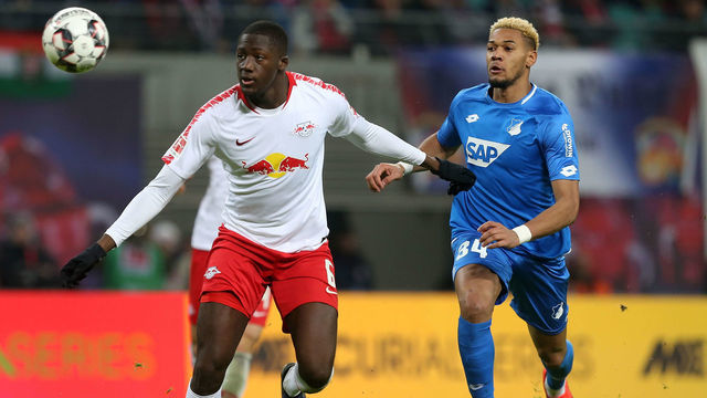 LEIPZIG, GERMANY - FEBRUARY 25: Ibrahima Konate (L) of Leipzig challenges for the ball with Joelinton of Hoffenheim during the Bundesliga match between RB Leipzig and TSG 1899 Hoffenheim at Red Bull Arena on February 25, 2019 in Leipzig, Germany.